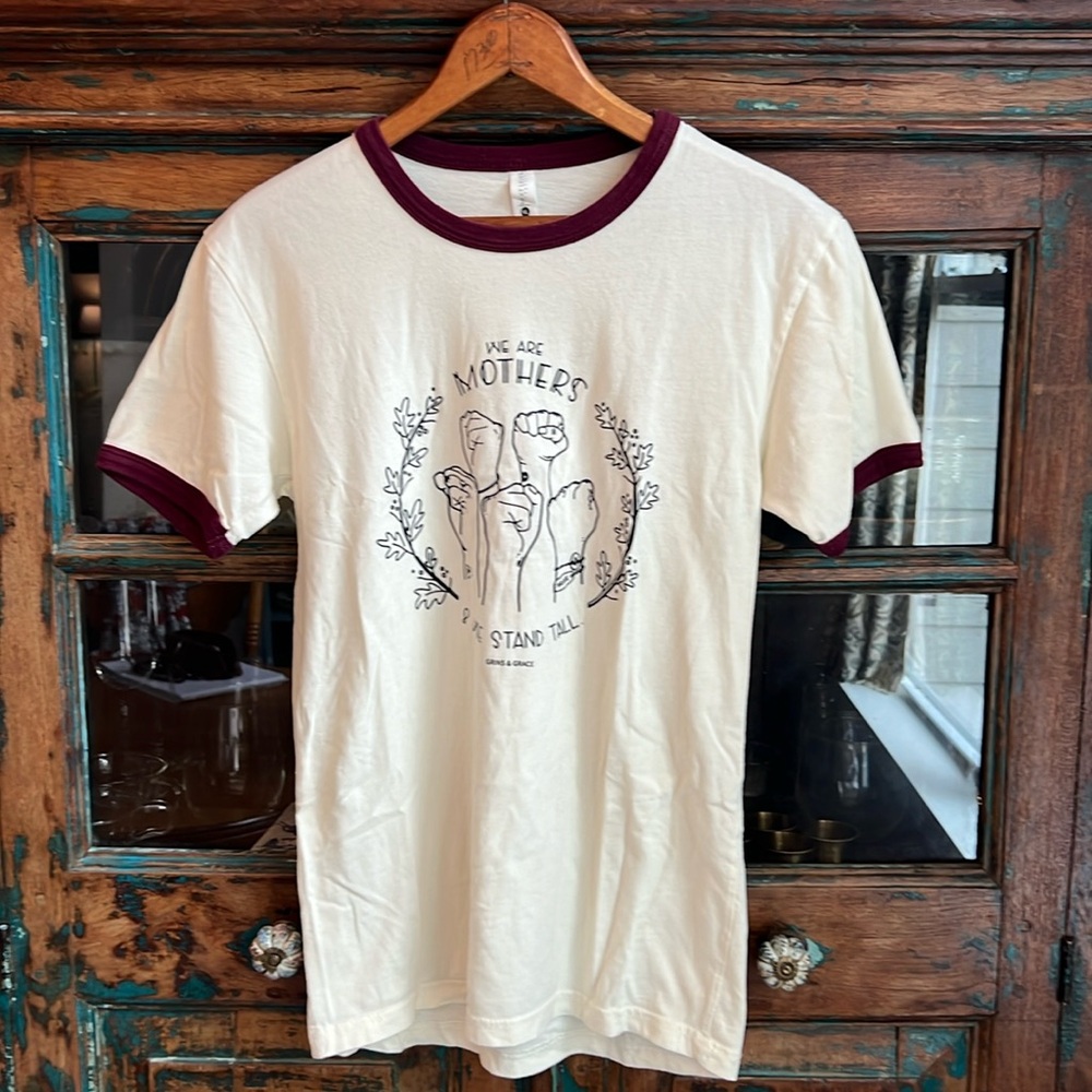 Grins & Grace T-Shirt XS Unisex
“We are Mothers”
70’s ringer vintage style